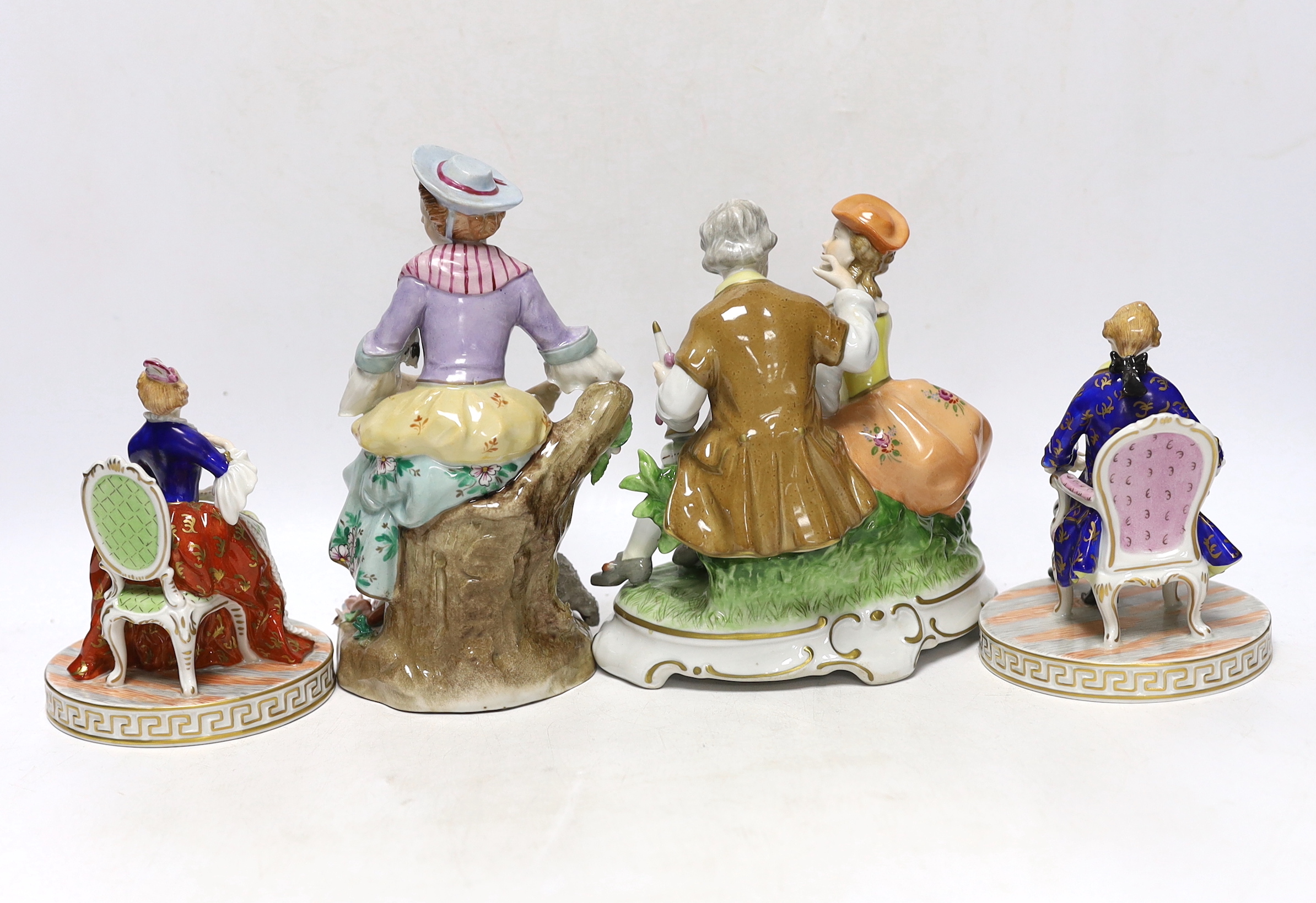 A pair of Dresden figures, a Sitzendorf shepherdess group and another German group